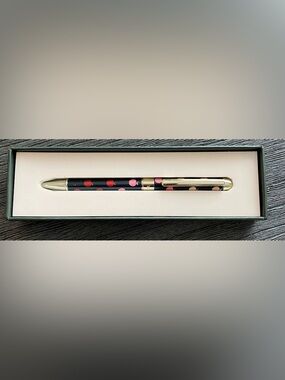 Kate Spade apple motif ink pen with gold accents, new, never used.